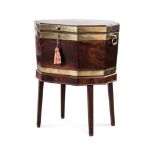 A REGENCY WALNUT AND BRASS BOUND CELLARETTE ON STAND the hinged octagonal lid enclosing a
