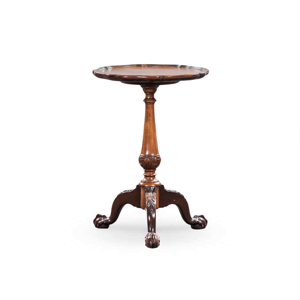 A GEORGE III STYLE WALNUT PIE-CRUST TABLE the quarter-veneered top on a turned tapering support,