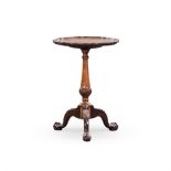 A GEORGE III STYLE WALNUT PIE-CRUST TABLE the quarter-veneered top on a turned tapering support,