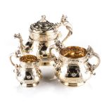 A LATE VICTORIAN SILVER-GILT BACHELOR'S TEA SERVICE, HENRY WILLIAM CURRY, LONDON, 1875 comprising: a