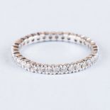 A DIAMOND ETERNITY RING claw set round brilliant-cut diamonds weighing approximately 0.50cts in