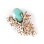 A DIAMOND AND POSSIBLE TURQUOISE BROOCH the oval cabochon is set among a spray of claw set