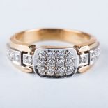 A DIAMOND DRESS RING the pave set diamonds in a cushion shape and then bands and then flanked by
