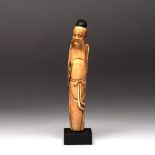 A CHINESE IVORY FIGURE OF AN IMMORTAL, MING DYNASTY, 1368 - 1644 NOT SUITABLE FOR EXPORT the