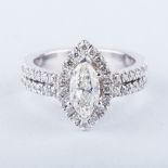 A MARQUISE DIAMOND RING the 0.812ct colour L, clarity SI3 marquise cut diamond claw-set and