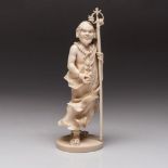 A JAPANESE IVORY OKIMONO OF A MONK, MEIJI PERIOD, 1868 - 1912 NOT SUITABLE FOR EXPORT standing on an