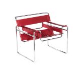 A WASSILY CHAIR DESIGNED IN 1925 BY MARCEL BREUER the red leather back and seat on a tubular steel