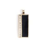 AN ONYX AND DIAMOND PENDANT the octagonal slice of onyx tube-set in 18k yellow gold and off set with