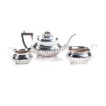 AN ENGLISH SILVER TEA SET,THOMAS WILLMORE, BIRMINGHAM, 1910 comprising: a teapot, a milk jug and a