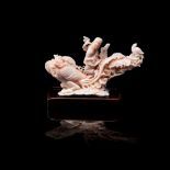 A CHINESE CARVED ANGEL SKIN CORAL ‘PHOENIX AND IMMORTAL’ FIGURAL GROUP NOT SUITABLE FOR EXPORT the