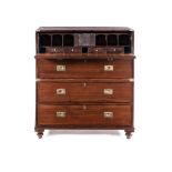 A TEAK SECRETAIRE MILITARY CHEST, 19TH CENTURY in two parts, the rectangular top above a hinged