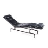 A CHAISE DESIGNED IN 1968 BY CHARLES AND RAY EAMES the leather cushions on a tubular steel frame
