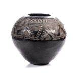 A CLAY BEER POT, ZULU the wide band filled with elaborate decorative patterns of triangles and