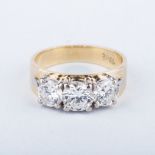 A DIAMOND TRILOGY RING of typical form. The diamonds weighing approximately 1.75ct in total,