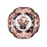 A JAPANESE IMARI LOBED BOWL, MEIJI PERIOD, 1868 – 1912 the well centred by a basket of flowers on