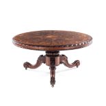 A VICTORIAN MAHOGANY AND INLAID TILT-TOP CENTRE TABLE the moulded circular top with floral and