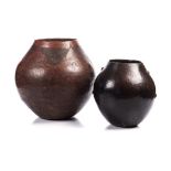 TWO CLAY POTS, (LEFISO), SOUTH SOTHO the tallest 36cm high Traditional clay pots continue to be made