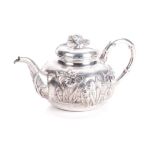 A JAPANESE BISANSHA SILVER TEA POT NOT SUITABLE FOR EXPORT the baluster body chased and embossed