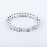 A FULL DIAMOND ETERNITY RING of typical form, the diamonds totalling approximately 1.2ct