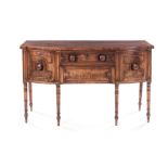 A GEORGE III SIDEBOARD the bow-fronted top above a central frieze drawer flanked by a pair of deep
