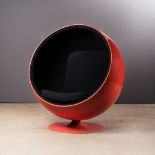 A FIBREGLASS AND UPHOLSTERED BALL CHAIR DESIGNED IN 1966 BY EERO AARNIO, MANUFACTURED BY ADELTA