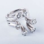 A DIAMOND RING the six tube-set round brilliant cut diamonds weighing approximately 2.45ct in total,
