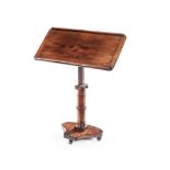 A VICTORIAN MAHOGANY LECTERN the tilting sloped rectangular top on a telescopic support, turned