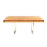 A REPRODUCTION OAK AND BRASS EXECUTIVE DESK AFTER A DESIGN BY BODIL KJAER, 20TH CENTURY the