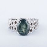 A GREEN SAPPHIRE, DIAMOND AND PLATINUM RING, ANPA the 5.804ct oval cut natural green sapphire four