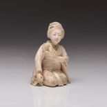 A JAPANESE IVORY OKIMONO OF A BIJIN, MEIJI PERIOD, 1868 - 1912 NOT SUITABLE FOR EXPORT the