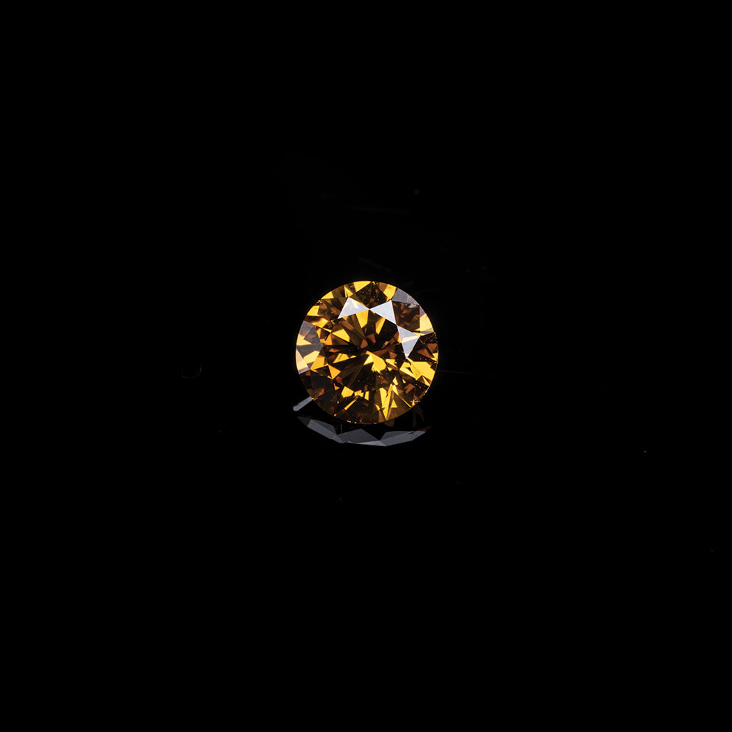 A FANCY DEEP YELLOW ORANGE DIAMOND the 0.79ct round brilliant cut is accompanied by a GIA