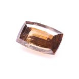 A 117.07CT CERUSSITE the step cushion cut cerussite is golden-brown in colour and accompanied by