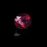 A 10.58CT RUBELLITE TOURMALINE the modified brilliant oval cut medium dark rubellite tourmaline