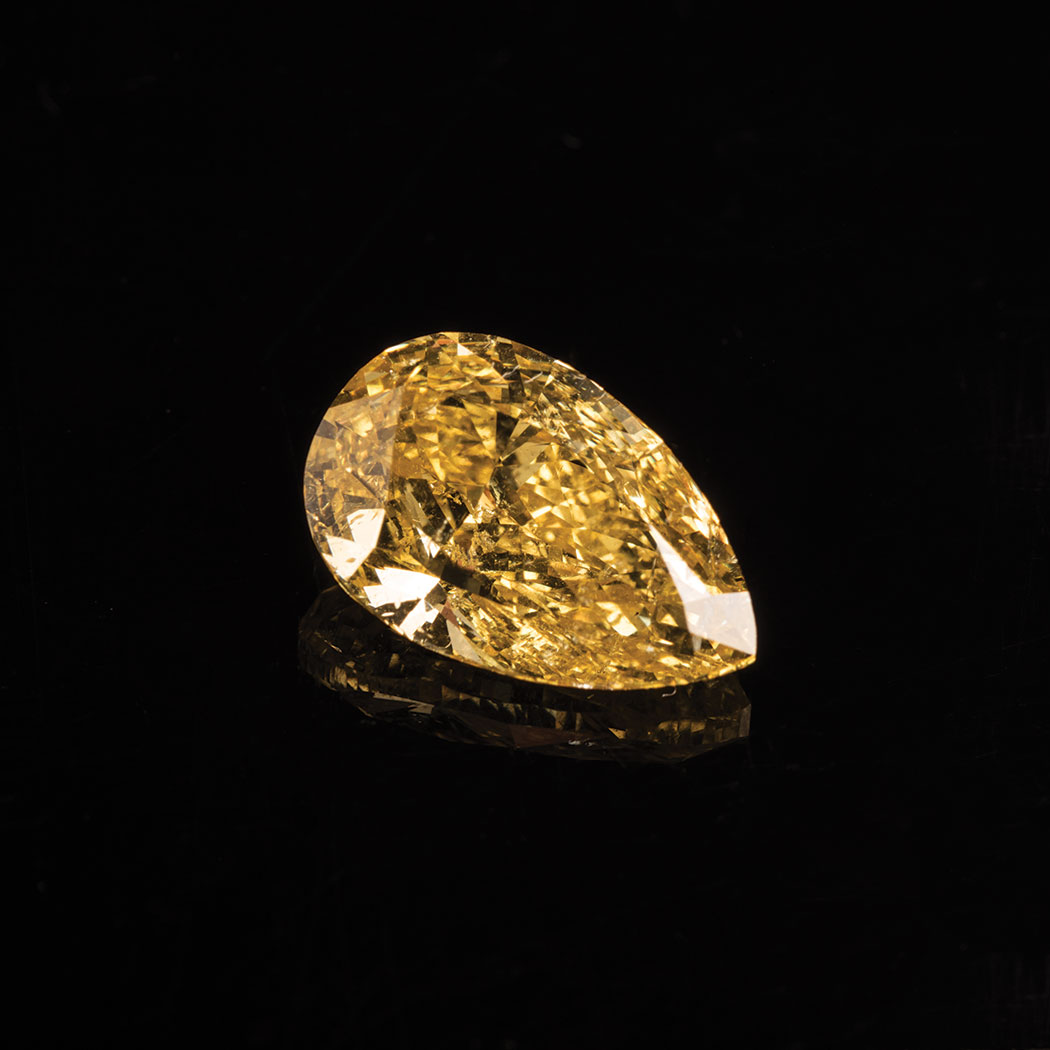 A FANCY VIVID YELLOW DIAMOND the 3.54ct modified brilliant pear cut, clarity I1 is accompanied by