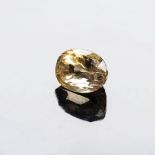 A 5.61CT SAPPHIRE the mixed oval cut medium dark golden yellow sapphire is accompanied by an ATG