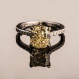 AN INTENSE FANCY YELLOW DIAMOND RING the 3.48ct cushion cut, clarity VS2 is accompanied by an EGL