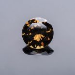 A 10.24CT ANDRADITE GARNET the round brilliant cut dark greenish brown Garnet is accompanied by a