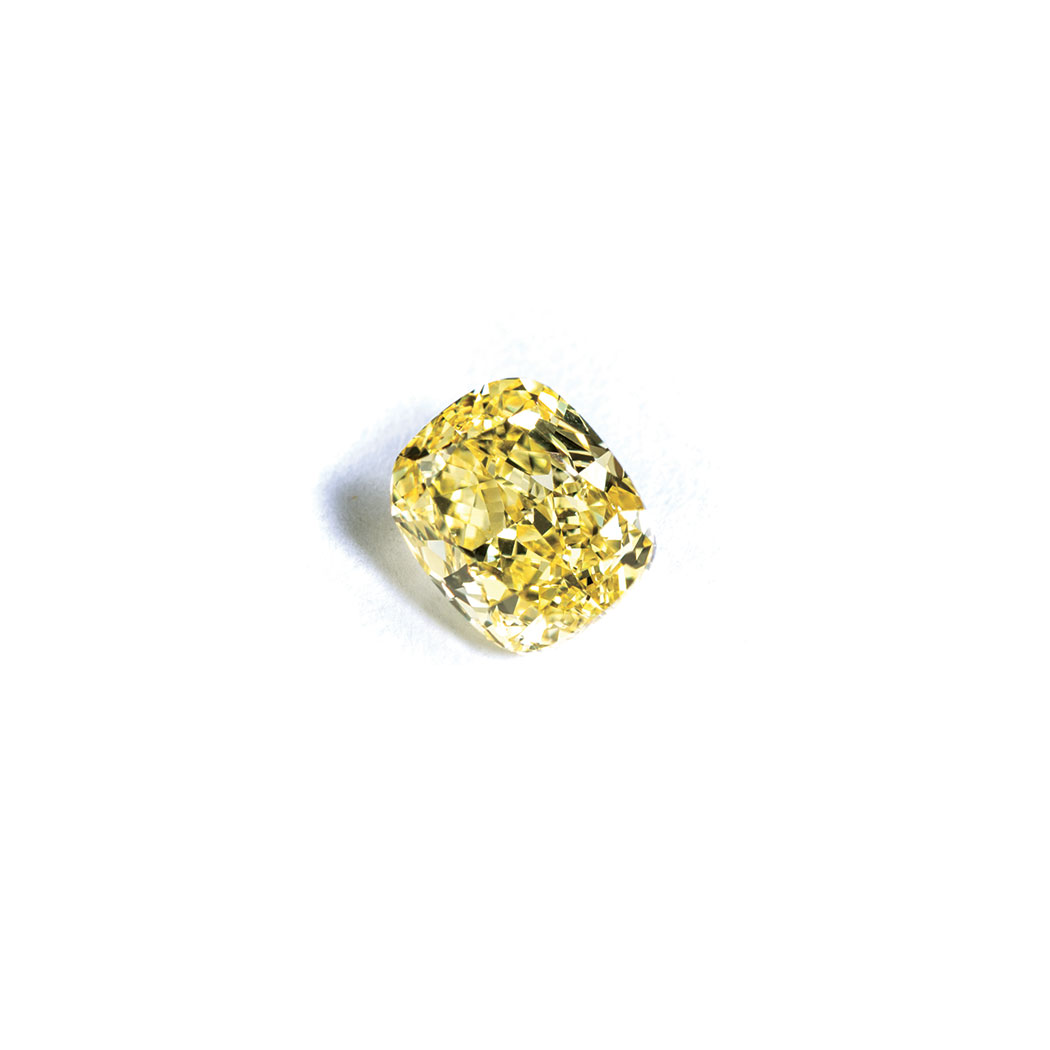 A FANCY VIVID YELLOW DIAMOND the 1.14ct modified brilliant cushion cut, clarity SI1 is accompanied