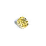 A FANCY VIVID YELLOW DIAMOND the 1.14ct modified brilliant cushion cut, clarity SI1 is accompanied