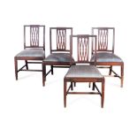 A SET OF FOUR MAHOGANY SIDE CHAIRS, EARLY 19TH CENTURY the shaped top rail above a pierced splat,