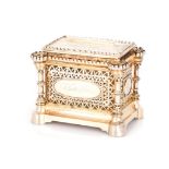 A VICTORIAN SILVER-GILT CASKET, JOHN WILMIN FIGG, LONDON, 1877 the rectangular openwork casket