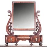 A VICTORIAN MAHOGANY TOILET MIRROR the rectangular plate within a conforming frame between scrolling