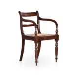 A CAPE REGENCY STINKWOOD ARMCHAIR