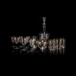 A GLASS AND GILT SHERRY DECANTER SUITE a matching set of 6 water glasses, all embossed with stylised