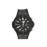 A GENTLEMANS STAINLESS STEEL CERAMIC WRISTWATCH, HUBLOT BIG BANG the black carbon fibre dial with