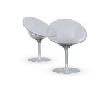 A PAIR OF EROS POLICARBONATE AND ALUMINIUM SWIVEL CHAIRS DESIGNED IN 2001 BY PHILIPPE STARK FOR