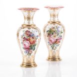 A PAIR OF MILK GLASS VASES each of baluster form decorated with flowerheads and foliage amongst gilt