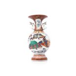 A JAPANESE VERTE IMARI STYLE VASE, TAISHŌ PERIOD, 1912 - 1926 raised on a high shaped foot, the