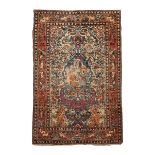 AN ISFAHAN RUG condition: fair 213cm by 134cm