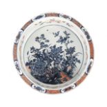 A CHINESE BLUE AND WHITE FAMILLE ROSE DECORATED EXPORT BASIN, QING DYNASTY, 19TH CENTURY the central